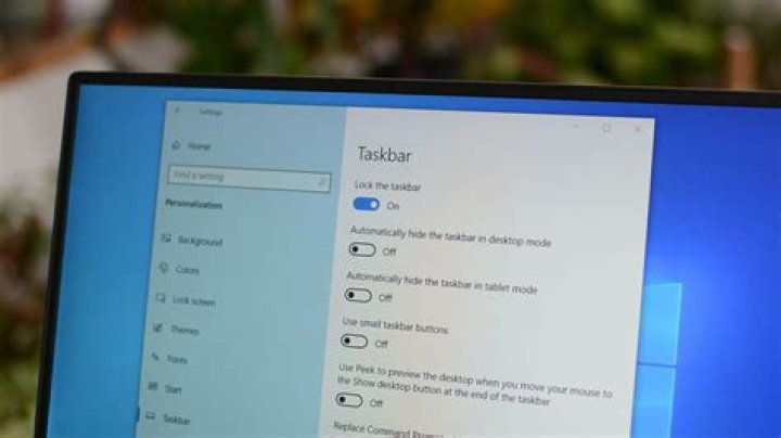 How can I hide certain playback devices in the Windows 10 taskbar?