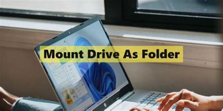 Mounting a hard drive as a folder in Windows?