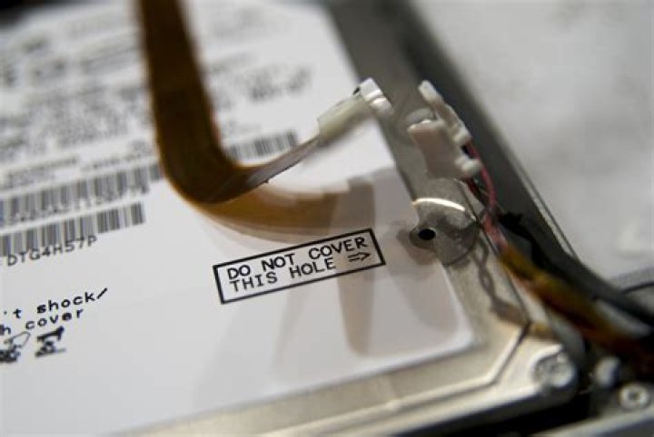 What is the purpose of the holes marked "Do Not Cover" on hard drives?